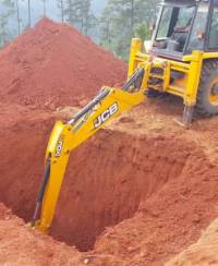 Picture of Cllr Jane's JCB digging a hole
